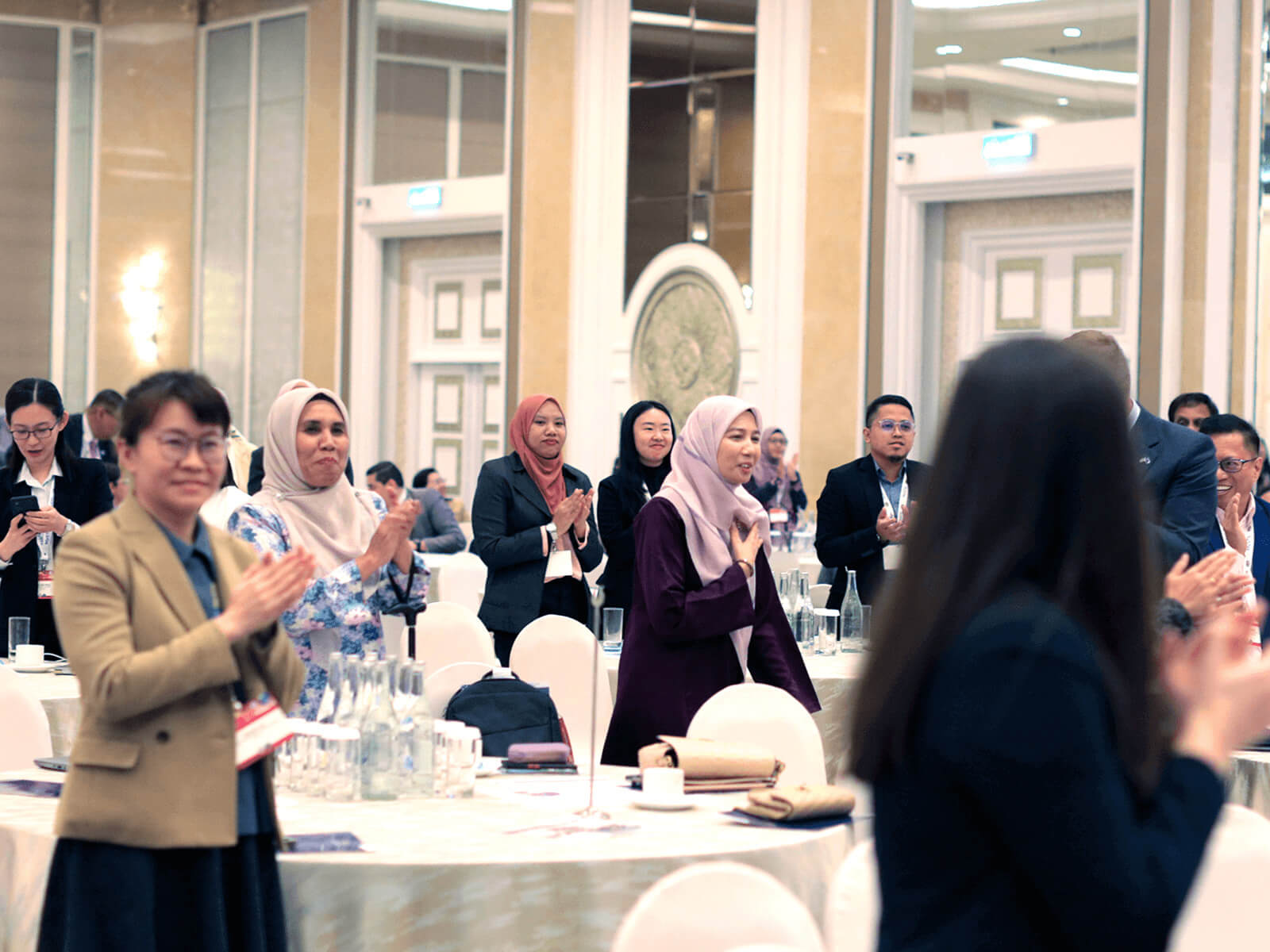 A group of people clapping