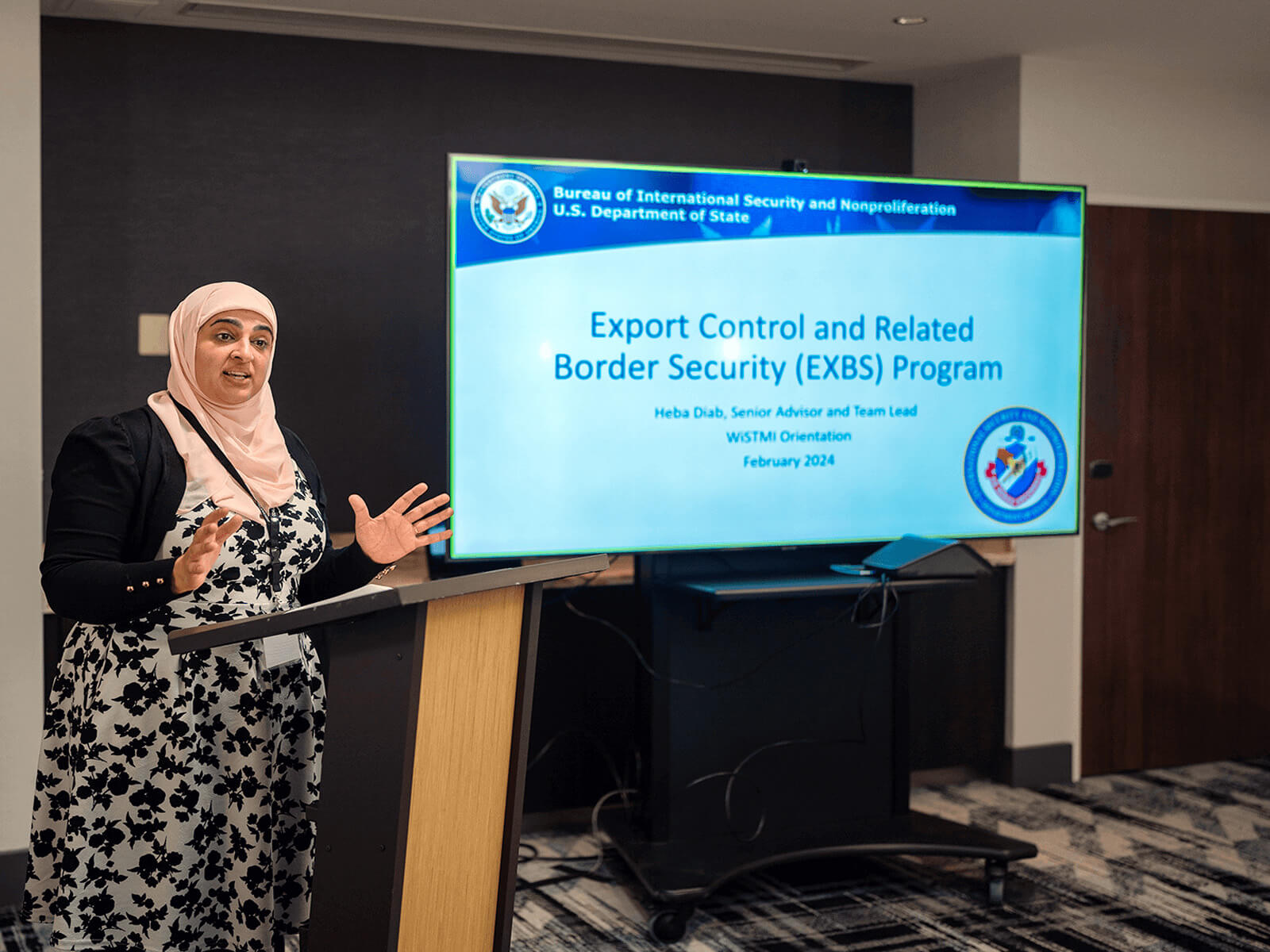 A woman presenting at a podium