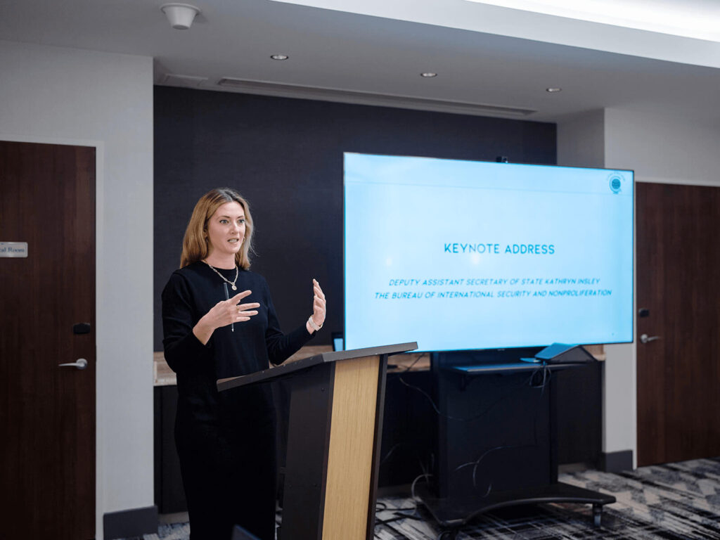 A woman presenting at a podium