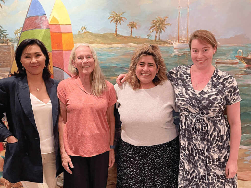 A group of women posing for a photo